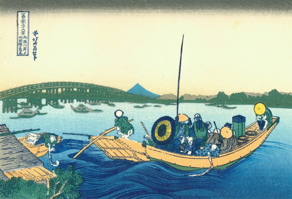 葛飾北斎《御厩川岸より両国橋夕陽見》Public domain, via Wikimedia Commons